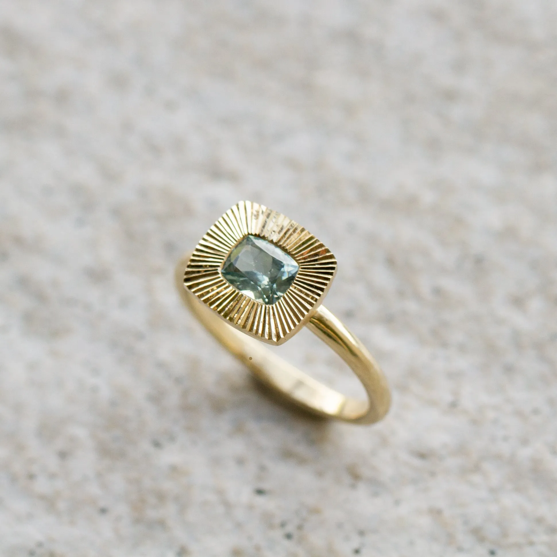 East-West Cushion Aurora Ring 14KY with Light Teal Montana Sapphire