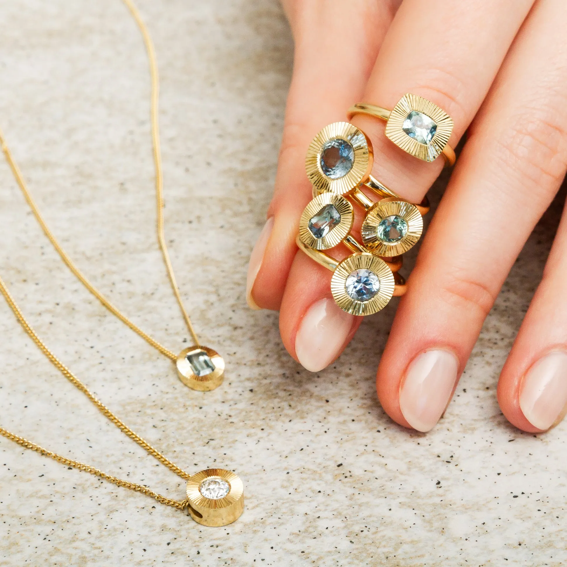 East-West Cushion Aurora Ring 14KY with Light Teal Montana Sapphire