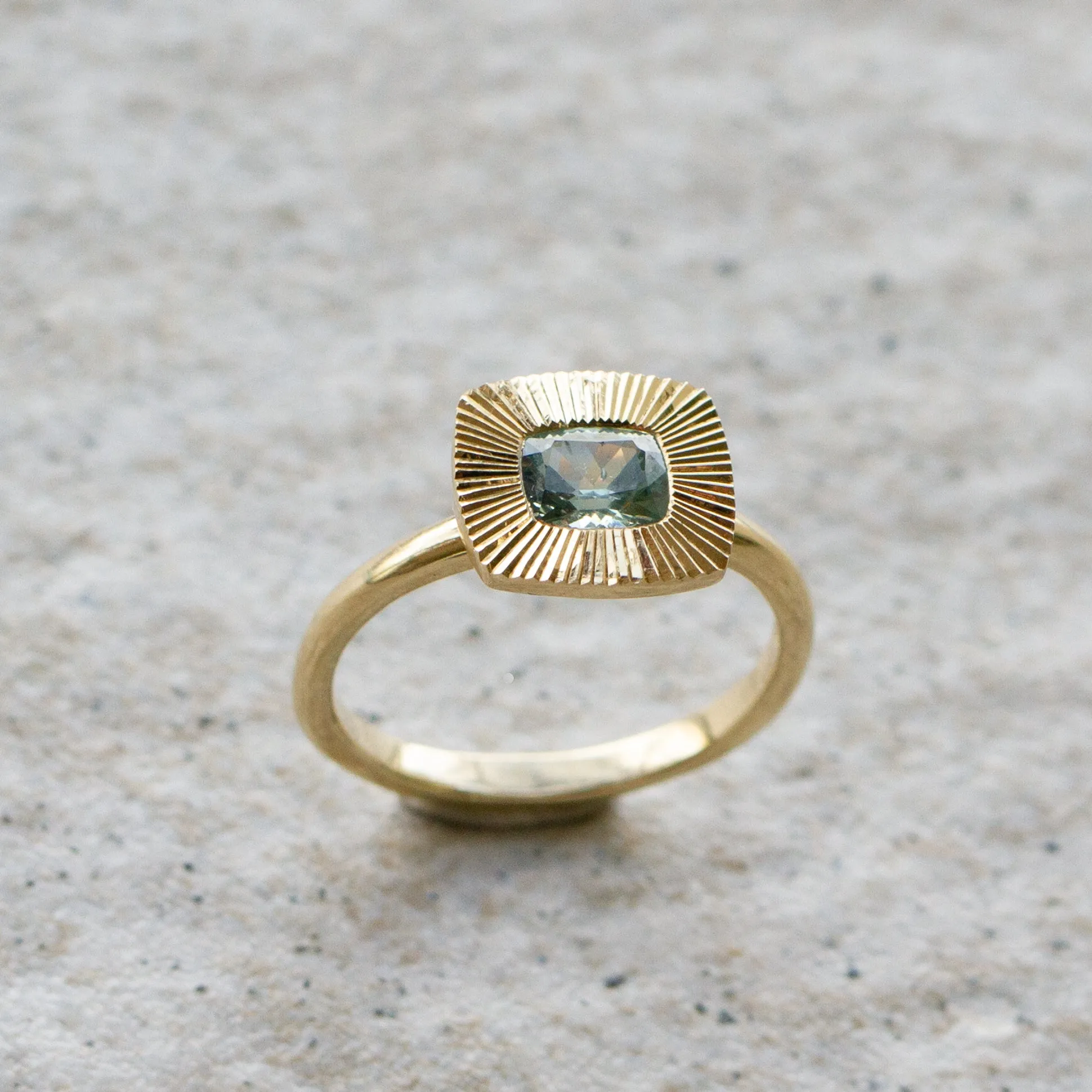 East-West Cushion Aurora Ring 14KY with Light Teal Montana Sapphire
